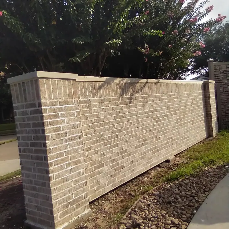 Brick screening wall with a cap along a property line