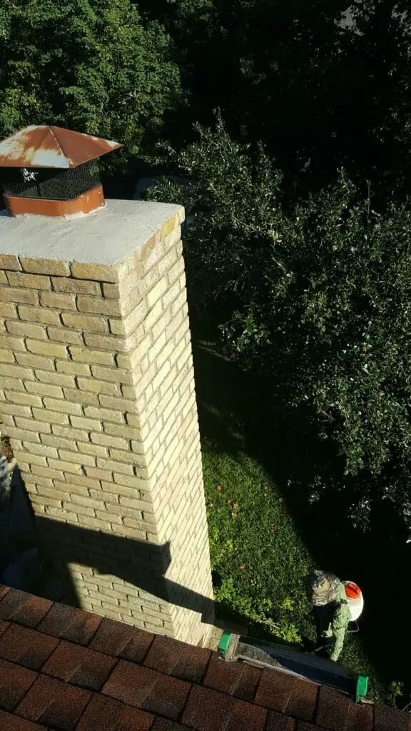 The same painted brick chimney after repair