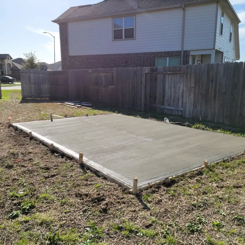 New concrete slab poured in a backyard