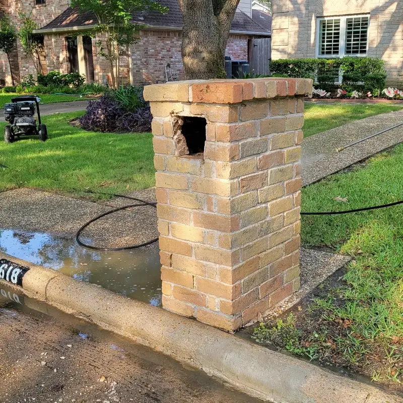 Brick mailbox column with a damaged top