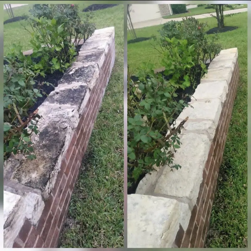Before and after photos of a weathered stone planter wall that was restored